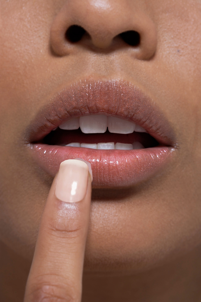 Female applying lip balm