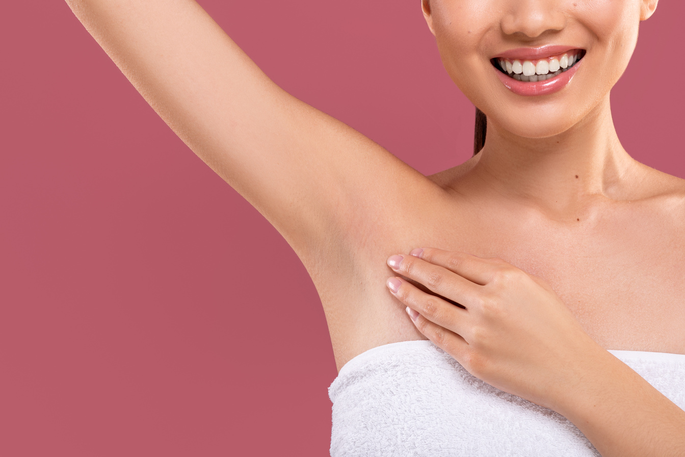 Unrecognizable lady lifting hand up, showing clean and hygienic armpits